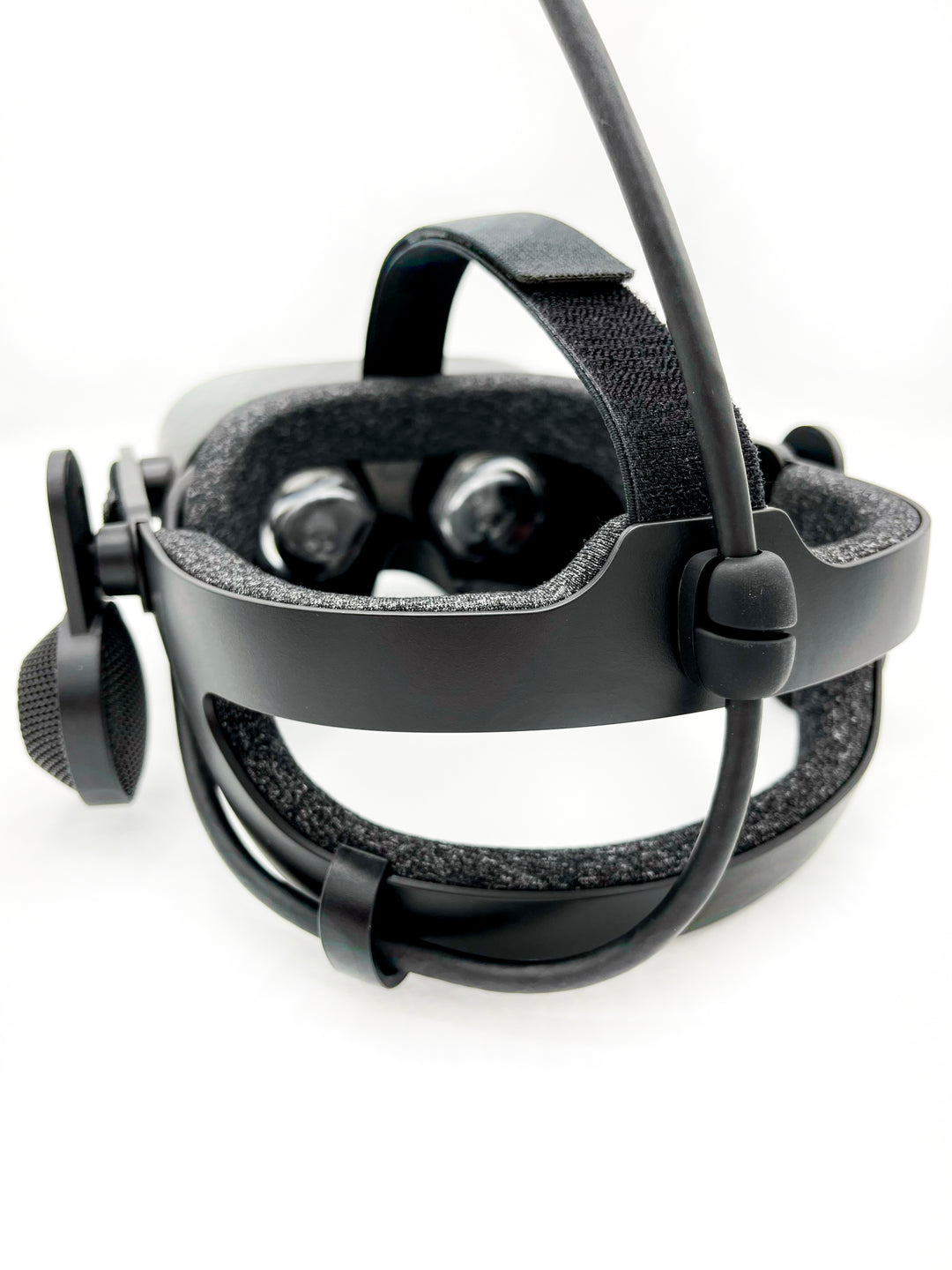 Black silicone cable holder on a headset